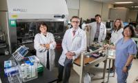 five members of the muranski lab in a lab setting